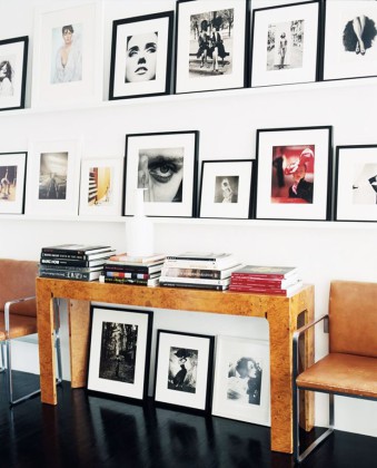 Modern photography gallery wall with modern burl console table and leather and chrome armchairs. item-thumbnail